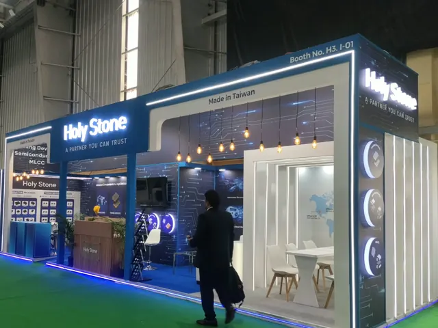 Holy Stone electronic components booth with LED outline, pendant lights and meeting cabin