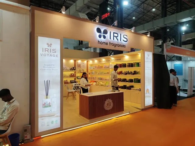 IRIS Home Fragrances exhibition stall with backlit shelving and fluted counter